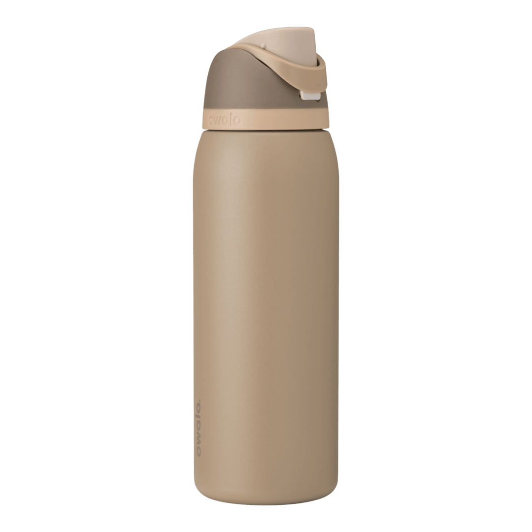 Full profile shot of the 40oz Down to Earth FreeSip water bottle in tan, highlighting its sleek design and sturdy construction.